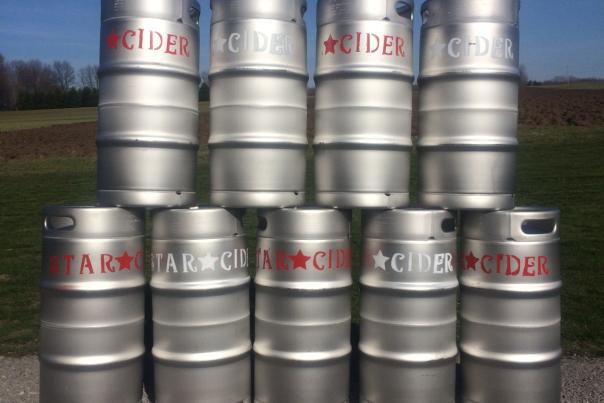 Kegs of Star Cider are lined up in a row