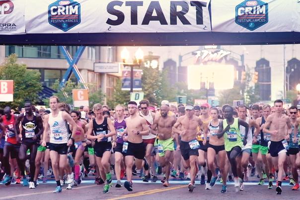 Runners beginning running under the start banner for the HAP Crim Festival of Races