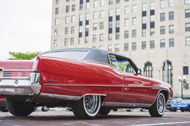 A classic red Elantra in downtown Flint during the Back to the Bricks cruise.