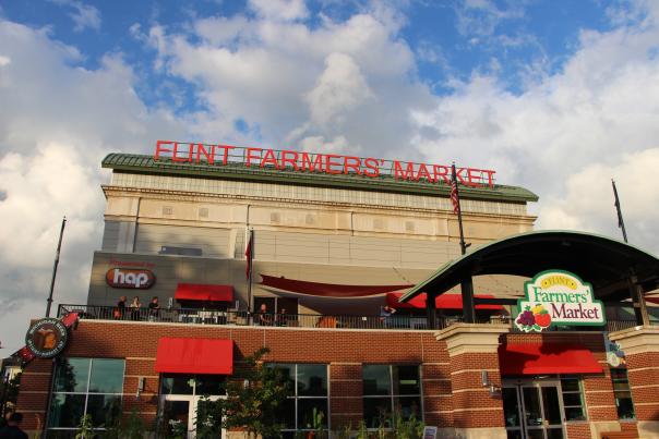 A long shot image of the outside of the Flint Farmers' Market building.