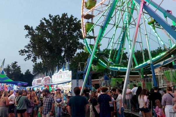 An image of the midway of St. John Applefest, in Fenton, at dusk.