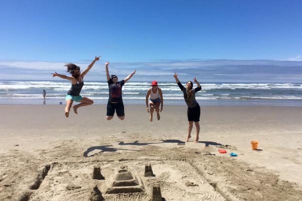 Girls Jumping on Beach