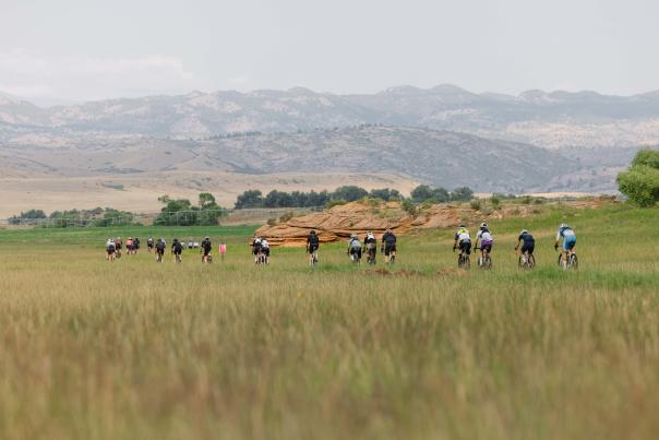 Riders in FoCo Fondo in the distance with Mountains.