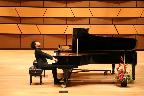 A pianist plays piano at the International Keyboard Odyssiad