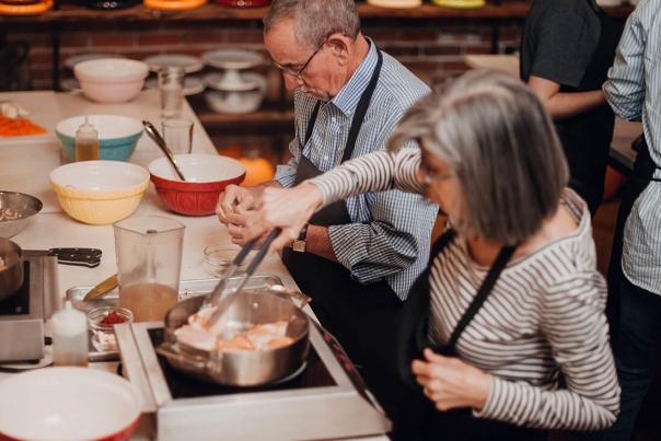 A couple takes a cooking class at Ginger and Baker