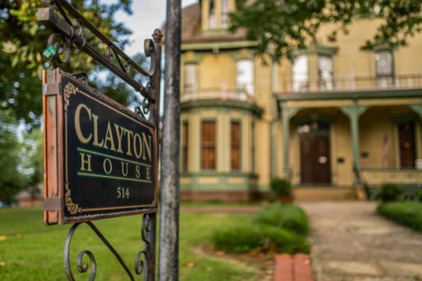 An ornate sign marks the historic Clayton House in Fort Smith, Arkansas.