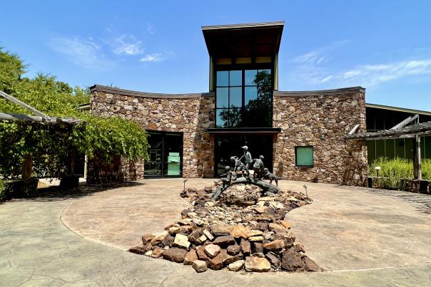 A wide angle shot displays the entrance to the Janet Huckabee Nature Center in Fort Smith, Arkansas.