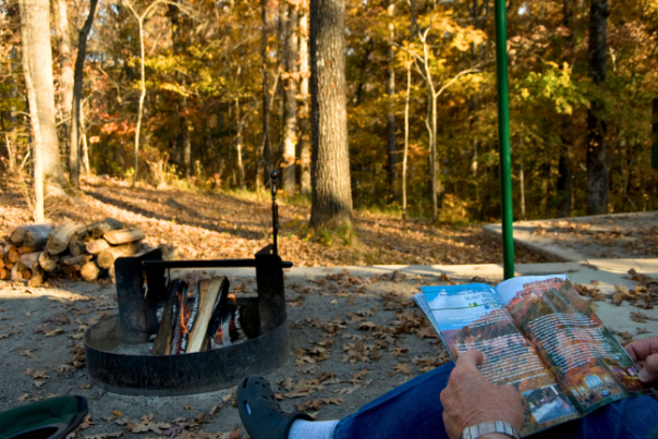 Campers enjoy a fall bonfire at Lake Fort Smith State Park.