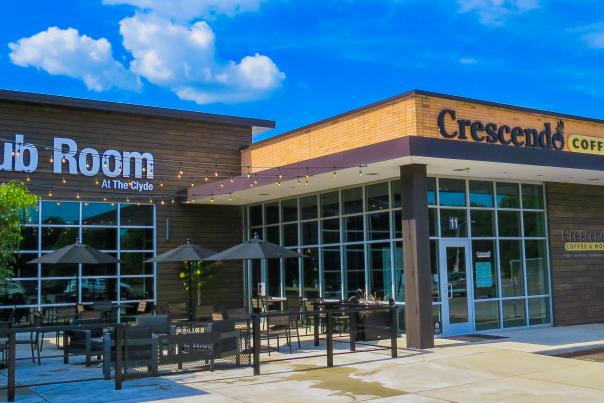 Exterior view of Crescendo Coffee Shop and outdoor dining patio