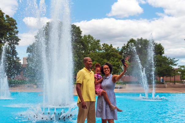 Family posing for a selfie in Freimann Square