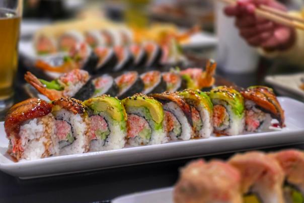 Assorted sushi rolls served on platters at a restaurant in Fort Wayne.
