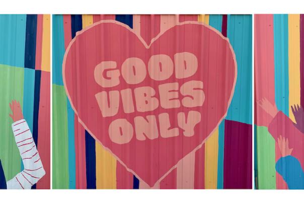 A brightly-colored mural in Fort Worth reads: Good Vibes Only.