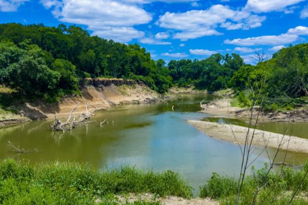 Overlooking the calm waters of the West Fork of Trinity River from Gateway Park in Fort Worth