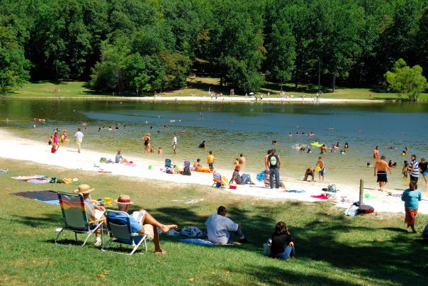 Visitors lounging on the beach at the Cunningham Falls Lake