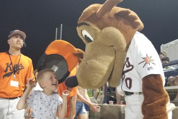 Kid meeting Frederick Keys coyote mascot "Frank Key"
