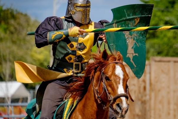 A knight on horseback in a jousting match