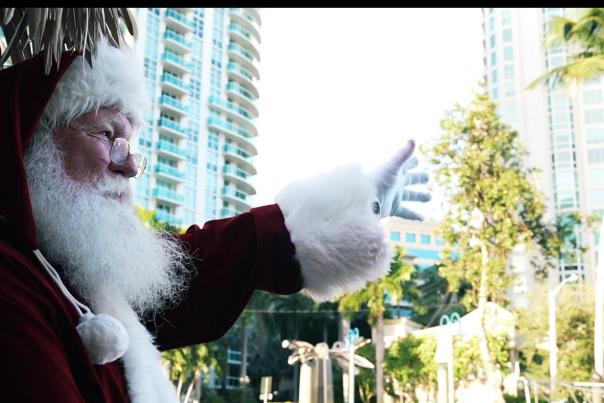 Santa waving from a Cruisin' Tiki on the New River in Fort Lauderdale