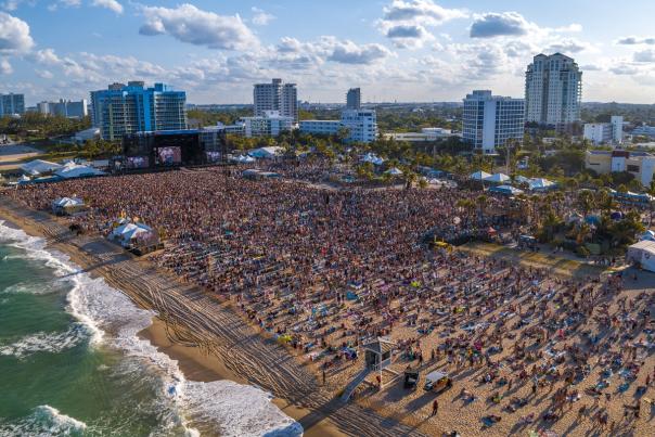 Aerial view of crowd at Tortuga Music Festival on Fort Lauderdale Beach taken looking southwest from the Atlantic Ocean