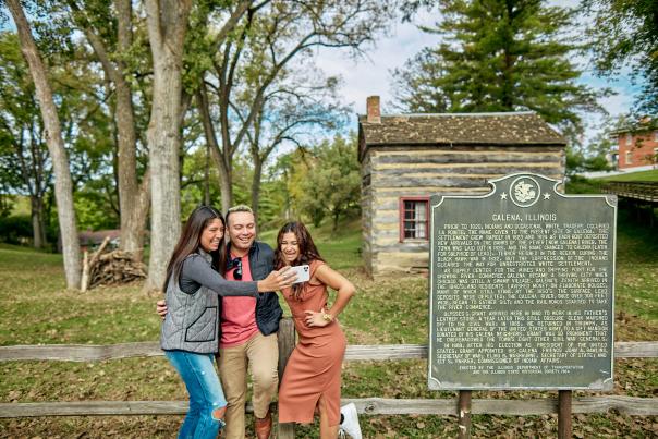 people taking picture next to sign outside Ulysses S. Grant Home in Galena Country