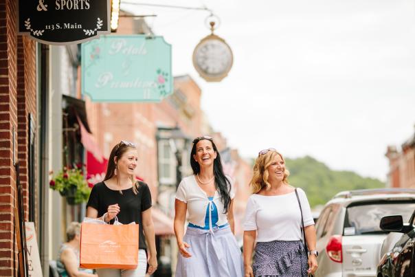 Three women shopping on Main Street Galena
