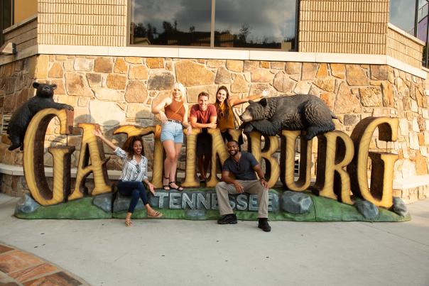 Friends in front of Gatlinburg sign