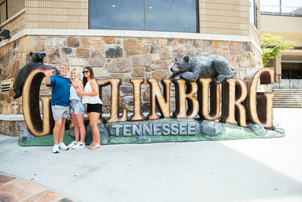 friends at Gatlinburg sign