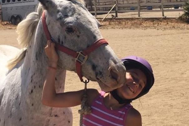Bright Ranch girl with white horse