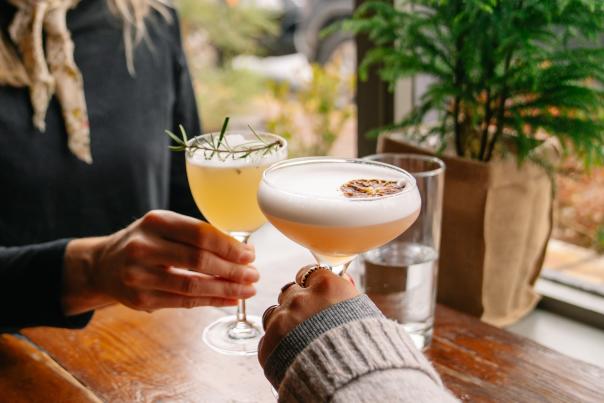 At Abejas restaurant in downtown Golden CO a couple cheers their cocktail drinks