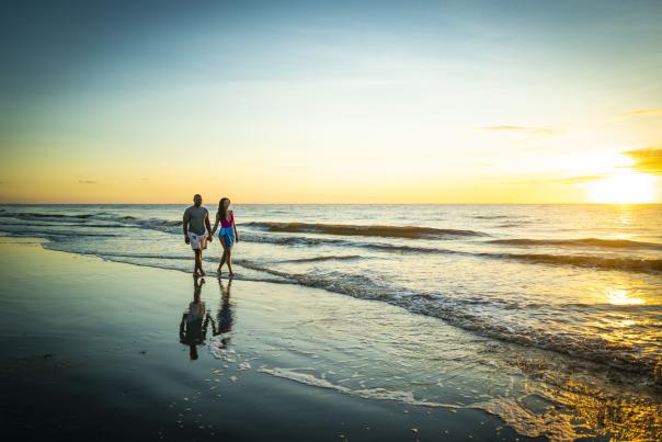 Couple walking on East Beach
