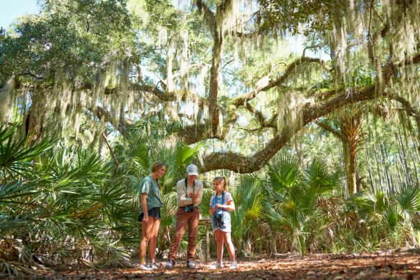 Family taking a guided tour on Little St. Simons Island