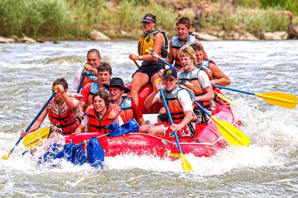 A group of teens whitewater rafting near Moab, Utah.
