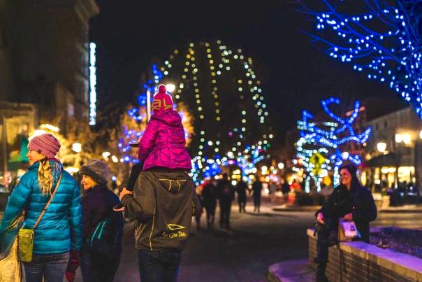 Family walking Downtown during Holiday Lights