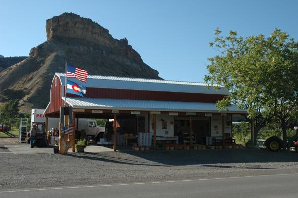 Colorado and America Flag in front of Clarks Family Orchard