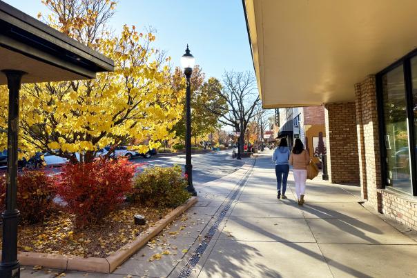 Two Women Walking Downtown during Fall
