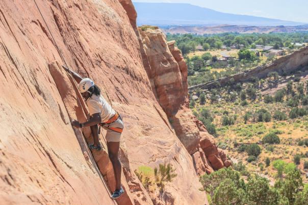 Person Rock Climbing in Grand Junction