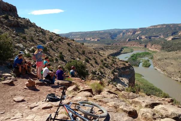Group of kids overlooking the Colorado River while Biking