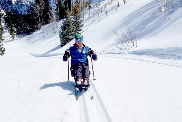 Man Cross-Country Skiing with Adaptive Equipment