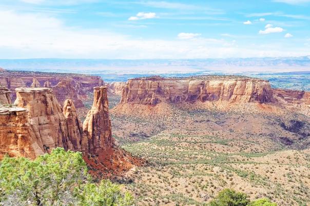View of Colorado National Monument with Book Cliffs in the background