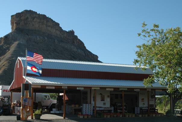 Colorado and America Flag in front of Clarks Family Orchard
