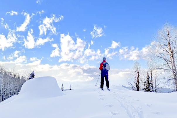 Man Looking Out Over Grand Mesa on Skis