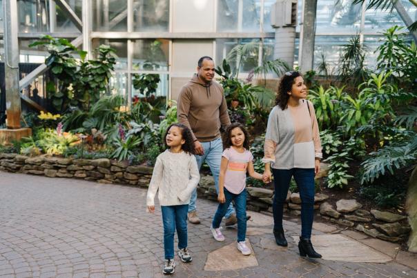 Family experiencing the Butterflies are Blooming Exhibition at the Frederik Meijer Gardens & Sculpture Park.