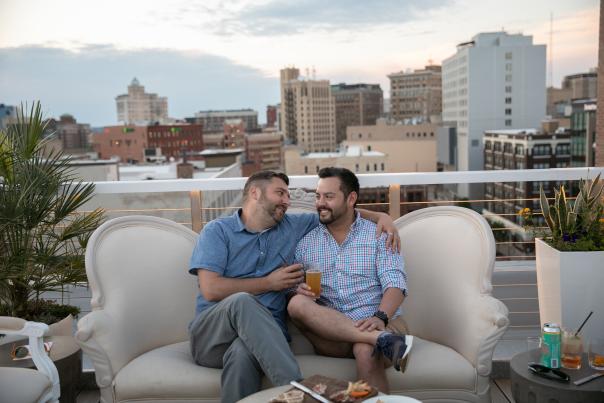 A couple enjoying appetizers and  craft beverages at Haute the rooftop In Grand Rapids, MI