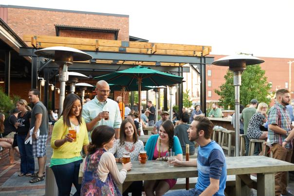 Friends enjoying a beer together at Founders Brewing Co.