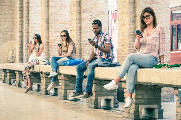 millennials staring at smartphones