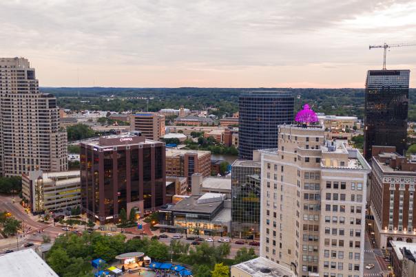 Rosa Parks Circle alive with a festival, Summer 2019. Cityscape view with the three AHC Hospitality hotels.