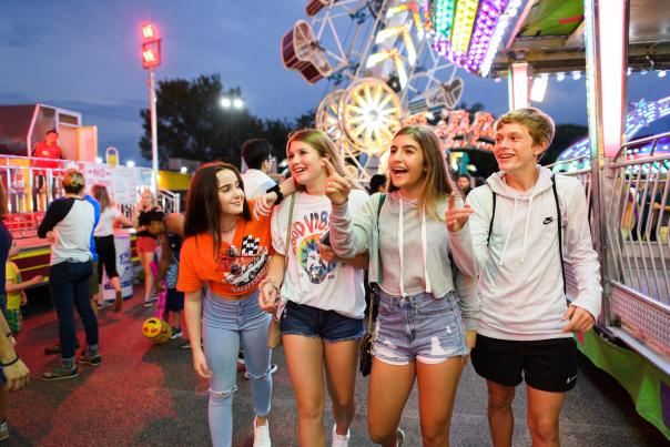 group of teenagers enjoying a carnival