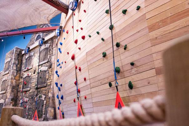 A picture of a climbing wall and ropes