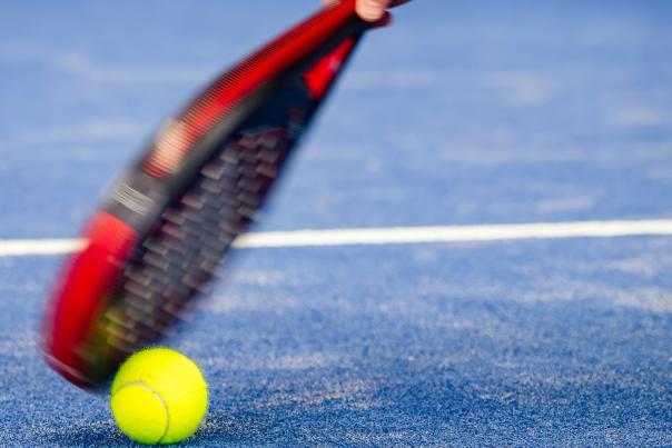 A padel racket and ball