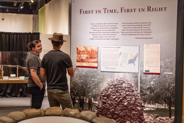 Two friends chatting about the exhibit at the Greeley History Museum