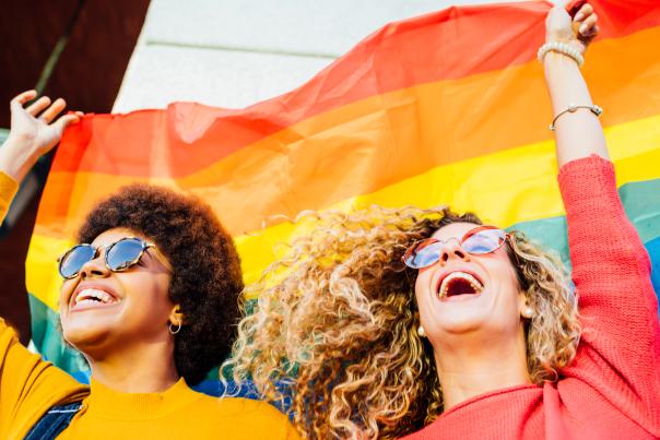 Two people celebrating Pride